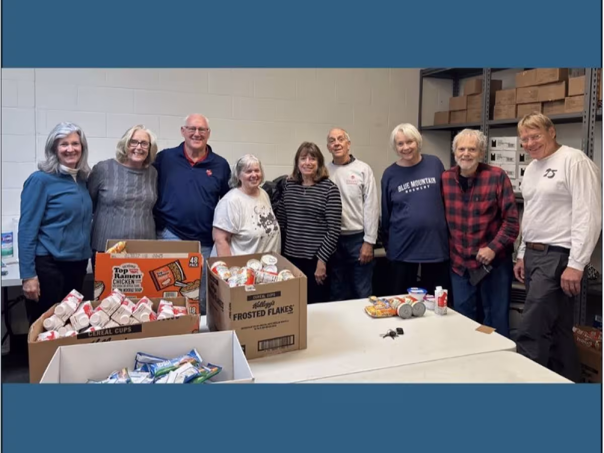 Volunteers packing food bags for the Food Backpack Program