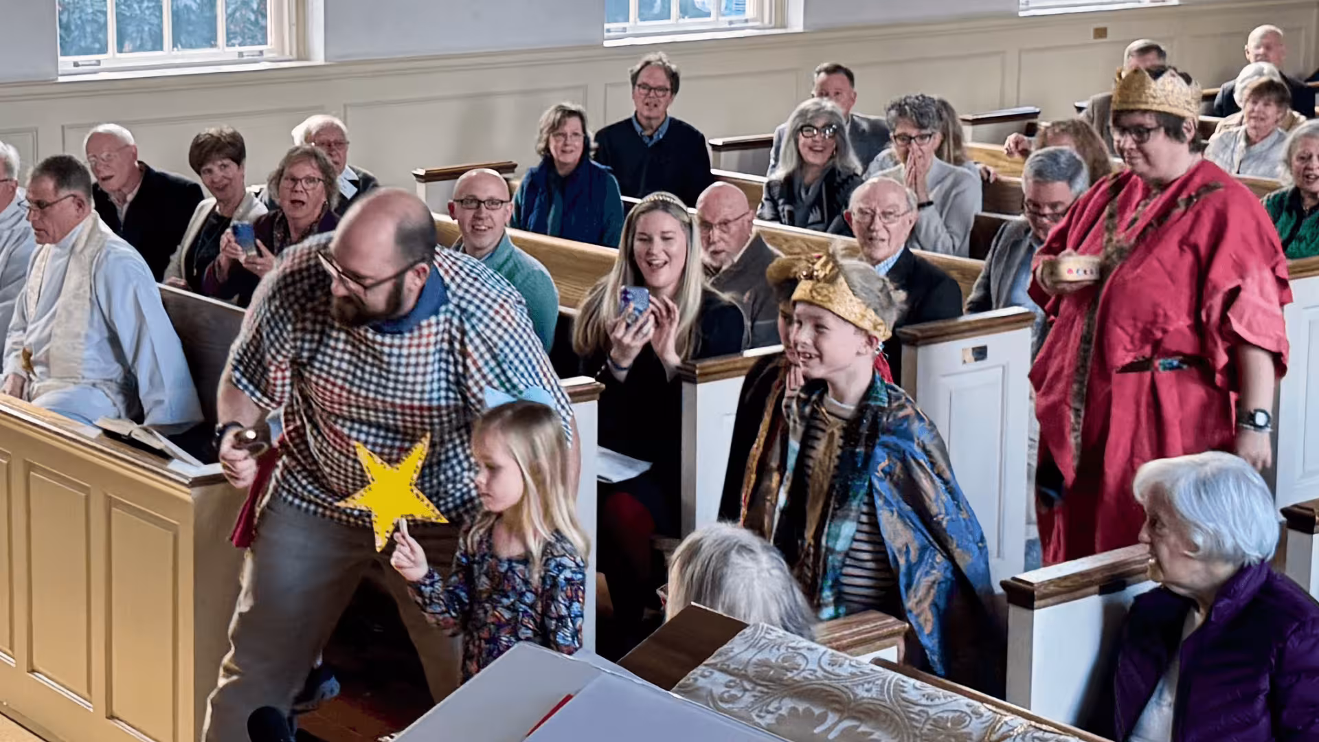 Parishioners and children gathered together for Sunday worship at St. James the Less